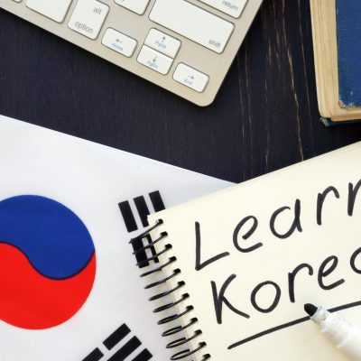 Learn Korean inscription with flag and keyboard.
